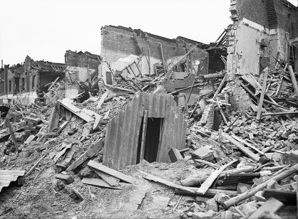 An Anderson shelter remains intact amidst destruction in Latham Street, Poplar, London during 1941. from the collections of the Imperial War Museums - Photograph D 5949